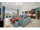 Bright and spacious living room with elegant decor and seamless access to outdoor patio and pool at 8261 Grande Shores Dr, Sarasota, FL 34240