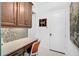 Functional office nook featuring a built-in desk, plenty of storage, and stylish decor at 8261 Grande Shores Dr, Sarasota, FL 34240