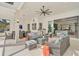Inviting covered patio featuring comfortable seating and access to the home's interior at 8261 Grande Shores Dr, Sarasota, FL 34240