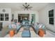 Inviting covered patio featuring comfortable seating, an outdoor bar area, and seamless access to the pool area at 8261 Grande Shores Dr, Sarasota, FL 34240