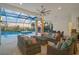 Inviting outdoor living space with a pool and comfortable seating, perfect for entertaining at 8261 Grande Shores Dr, Sarasota, FL 34240
