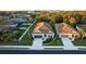 Charming one-story home with a well-maintained lawn and two-car garage, as well as lush landscaping at 176 Avens Dr, Nokomis, FL 34275