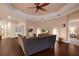 Spacious living room featuring hardwood floors, a ceiling fan, and neutral walls that create an inviting atmosphere at 176 Avens Dr, Nokomis, FL 34275