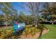 Scenic view of Hecksher Park with lush greenery and mature trees, offering a peaceful retreat at 176 Avens Dr, Nokomis, FL 34275