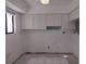 Image of a kitchen with white cabinets and new tile work at 1801 Gulf N Dr # 121, Bradenton Beach, FL 34217