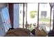 Living room with sliding glass doors to patio and view at 1801 Gulf N Dr # 121, Bradenton Beach, FL 34217