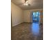 Empty bedroom with tile floors, ceiling fan, and natural light from the windows at 4615 Hidden View Pl # 26, Sarasota, FL 34235