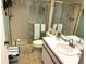 Tiled bathroom with a glass-enclosed shower and bright white vanity at 515 30Th W Ave # H207, Bradenton, FL 34205