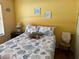 Bright bedroom with a comfortable bed, charming decor, and a cozy ambiance at 515 30Th W Ave # H207, Bradenton, FL 34205