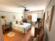 Well-lit bedroom with charming decor, wicker furniture, and a comfortable bed at 515 30Th W Ave # H207, Bradenton, FL 34205
