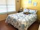 Bedroom with seashell themed bedding and decor at 515 30Th W Ave # H207, Bradenton, FL 34205