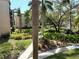 Beautifully landscaped grounds with lush foliage, flowers, and walkways at 515 30Th W Ave # H207, Bradenton, FL 34205