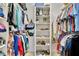 Organized walk-in closet with shelving, hanging rods, shoes, purses, and plenty of clothing at 5972 Giardino Ln, Sarasota, FL 34232