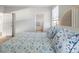 Comfortable bedroom leading to a bright bathroom, offering a peaceful retreat at 114 Gull Dr, Anna Maria, FL 34216