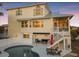 Charming two-story beach house features a private pool and screened-in porch at 114 Gull Dr, Anna Maria, FL 34216