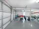 Spacious garage with ample room for parking and storage of bikes and sporting equipment at 114 Gull Dr, Anna Maria, FL 34216