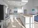 Bright kitchen featuring stainless steel appliances, white cabinetry, and lots of natural light at 114 Gull Dr, Anna Maria, FL 34216