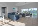 Bright living room featuring tile floors, waterfront views and comfortable seating at 114 Gull Dr, Anna Maria, FL 34216