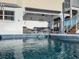 Inviting pool with a relaxing lounge area, perfect for outdoor enjoyment and entertaining at 114 Gull Dr, Anna Maria, FL 34216