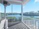 Enjoy scenic water views from this screened porch, perfect for relaxing and entertaining at 114 Gull Dr, Anna Maria, FL 34216