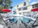 Backyard swimming pool with lounge chairs and a view of the home at 114 Gull Dr, Anna Maria, FL 34216
