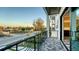 Scenic balcony view with decorative railings and patterned tile flooring overlooking a quiet residential area at 1214 Gulf Blvd, Englewood, FL 34223