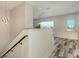 Foyer featuring wood-look floors, white walls, and contemporary lighting at 1214 Gulf Blvd, Englewood, FL 34223