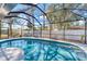 Inviting screened-in pool area with clear blue water and comfortable seating at 1219 Sleepy Hollow Rd, Venice, FL 34285