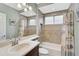 Bathroom with tiled shower and tub combination, decorative shower curtain and neutral wall color at 1227 Tuscany Blvd, Venice, FL 34292