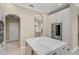 Well-appointed kitchen with island, stainless steel appliances, and ample cabinet space, perfect for cooking at 1227 Tuscany Blvd, Venice, FL 34292