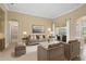Comfortable living room with stylish furniture, ample seating, and a view of the outdoor patio at 1227 Tuscany Blvd, Venice, FL 34292