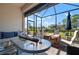 Screened lanai furnished with comfortable seating and a table at 14369 Eagle Branch Dr, Nokomis, FL 34275