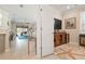 Spacious living room with sliding glass doors and partial view of sitting room at 14369 Eagle Branch Dr, Nokomis, FL 34275