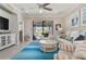 Bright living room showcases stylish decor, access to outdoor space, and tile flooring at 14369 Eagle Branch Dr, Nokomis, FL 34275