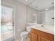 Cozy bathroom featuring a toilet, sink, shower, and a door to the outside pool area at 2773 Harvest Dr, Sarasota, FL 34240