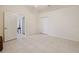 Bright bedroom features tile floors, with a closet, and a doorway to another room at 2773 Harvest Dr, Sarasota, FL 34240