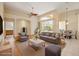 Sun-filled living room with vaulted ceilings and large windows overlooking the pool area at 2773 Harvest Dr, Sarasota, FL 34240