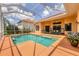 Screened in pool area, including the pool, patio, and exercise equipment at 2773 Harvest Dr, Sarasota, FL 34240
