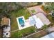 Overhead view of home with a pool, landscaped yard, storage shed, and patio area at 2826 Marlette St, Sarasota, FL 34231