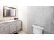 Bathroom featuring granite countertop vanity and tile surround at 2826 Marlette St, Sarasota, FL 34231