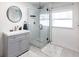 Bright bathroom featuring a modern vanity and frameless glass shower with subway tile surround at 2826 Marlette St, Sarasota, FL 34231