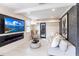 Modern living room featuring an electric fireplace, large TV, and comfortable seating at 2826 Marlette St, Sarasota, FL 34231