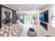 Bright living area with a decorative fireplace, contemporary furnishings, and ample natural light at 2826 Marlette St, Sarasota, FL 34231