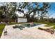 Relaxing backyard pool area with lounge chairs and lush landscaping at 2826 Marlette St, Sarasota, FL 34231