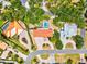 An aerial view showing this property's proximity to lush greenery, waterfront access, and meticulously kept landscaping at 424 Cezanne Dr, Osprey, FL 34229