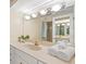 Bathroom featuring granite countertops and a large mirror at 424 Cezanne Dr, Osprey, FL 34229