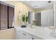Bright bathroom featuring a wide mirror, generous counterspace and storage options at 424 Cezanne Dr, Osprey, FL 34229