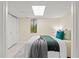 Cozy bedroom with a large window, closet, and comfortable bed at 424 Cezanne Dr, Osprey, FL 34229