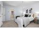 Cozy bedroom with neutral tones, plush carpet, and comfortable bedding, providing a relaxing retreat at 424 Cezanne Dr, Osprey, FL 34229