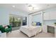 Bright bedroom with large windows overlooking lush greenery and built-in storage at 424 Cezanne Dr, Osprey, FL 34229
